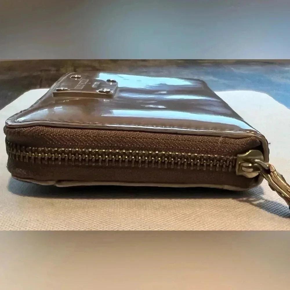 Kate Spade New York| ladies Continental patent leather zip around wallet.